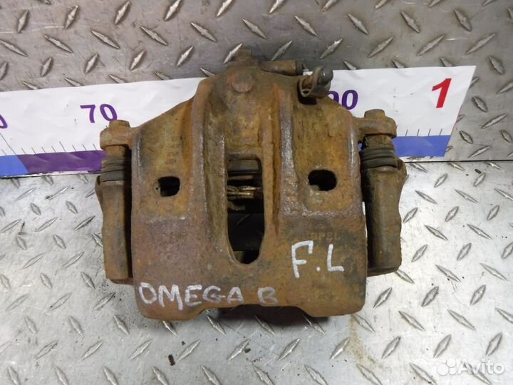 Суппорт передний левый Opel Omega B