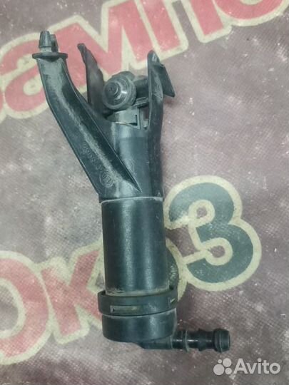 Форсунка омывателя фары Nissan Note