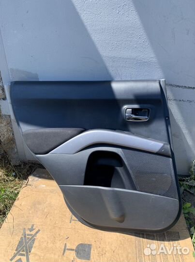 Обшивка двери Outlander xl 2011