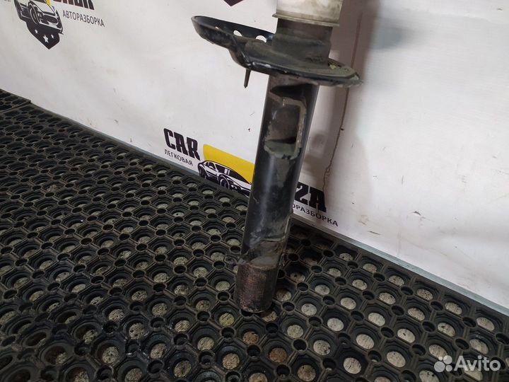 Стойка амортизатора передняя левая L