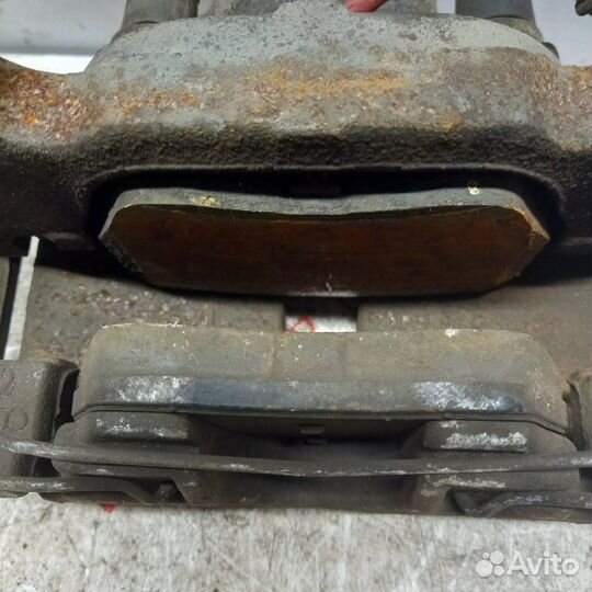 Суппорт тормозной передний левый Volkswagen Touran