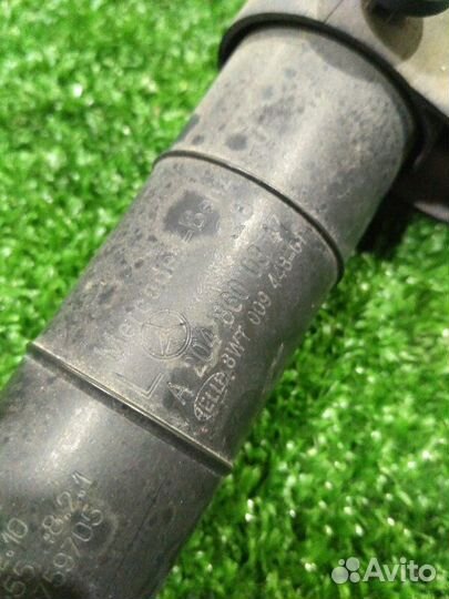 Форсунка омывателя фар передняя левая