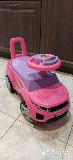 Машинка каталка музыкальная