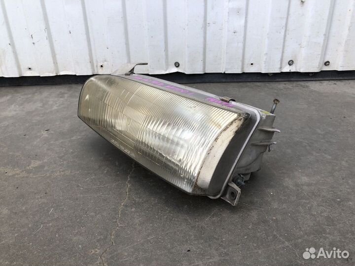 Фара левая Toyota Sprinter AE100