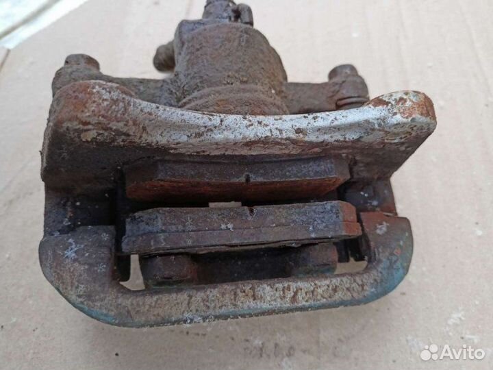 Суппорт тормозной задний левый Chevrolet Lacetti