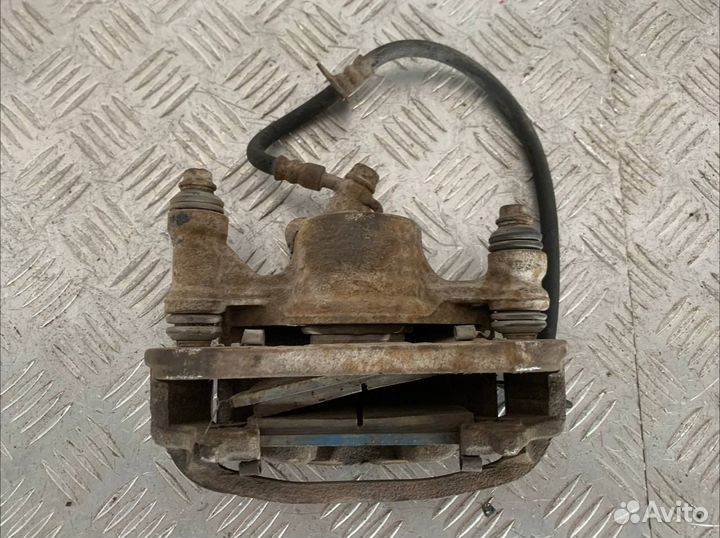 Суппорт тормозной левый Тойота Королла EE107V