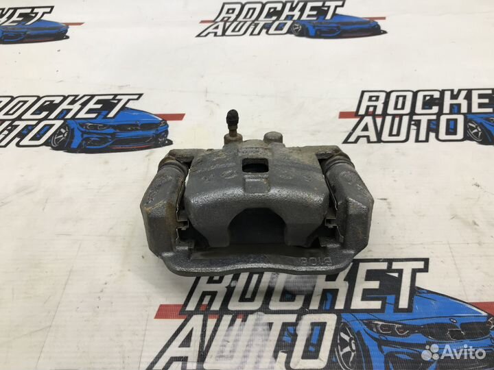 Суппорт тормозной задний левый Subaru Forester SG