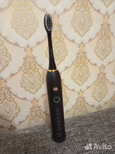 Электрическая зубная щетка