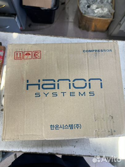 Компрессор кондиционе grand starex 97701-4H010