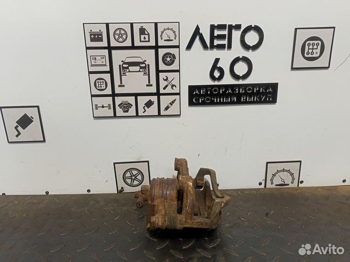 Суппорт тормозной левый Nissan Almera Classiс B10