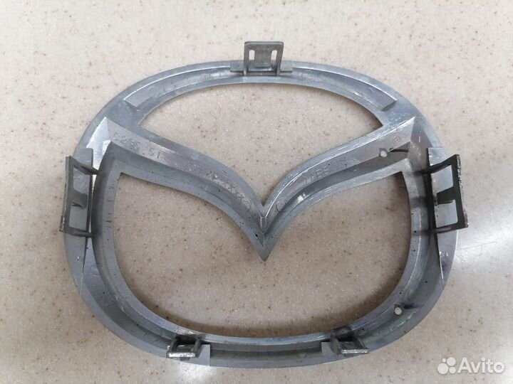 Эмблема Mazda 6