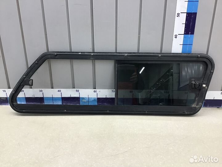 Стекло кузовное глухое левое Mitsubishi L200 (KB)