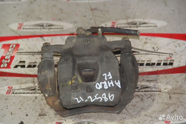 Суппорт перед лево c Toyota Alphard ANH10W 2AZ-FE