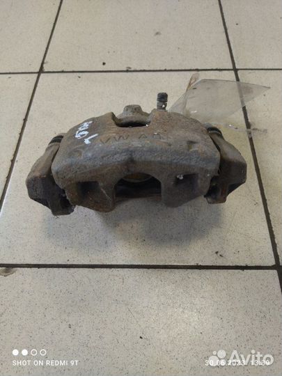 Суппорт тормозной передний левый Volkswagen Polo