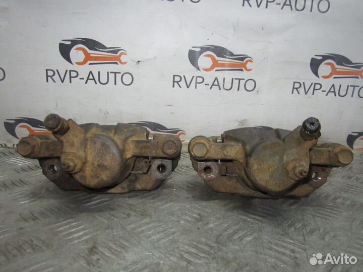 Суппорт тормозной задний Nissan Laurel C35 1997-02