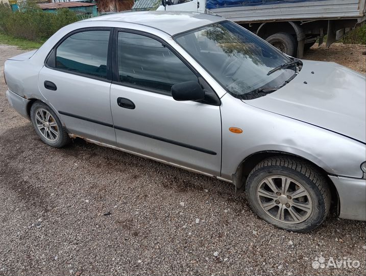 Двигатель на mazda 323