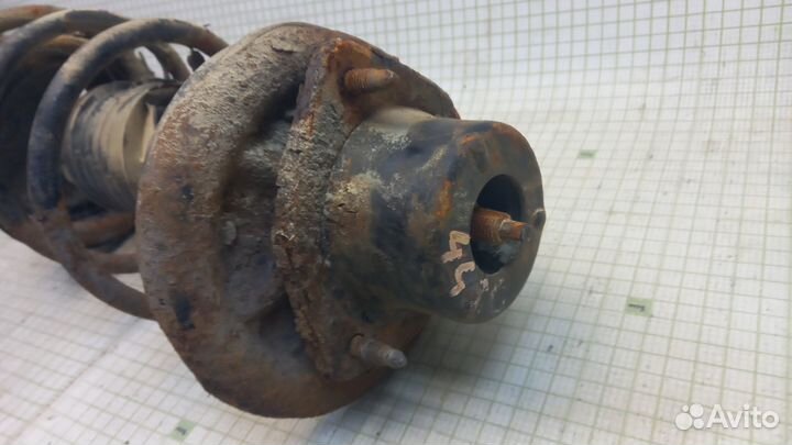 Амортизатор передний левый Nissan Sunny