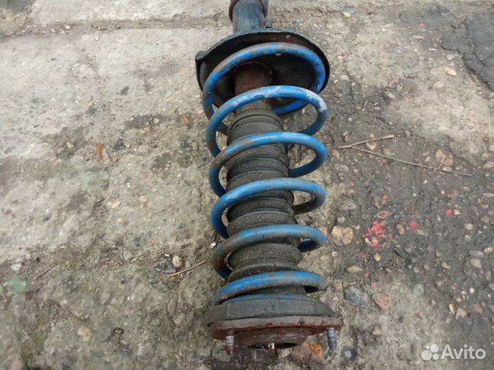 Стойка амортизатора задняя левая Hyundai Accent 2