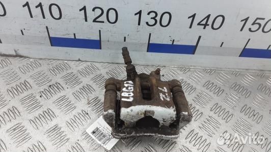 Суппорт тормозной задний левый toyota corolla E12