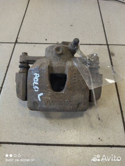 Суппорт тормозной передний левый Volkswagen Polo