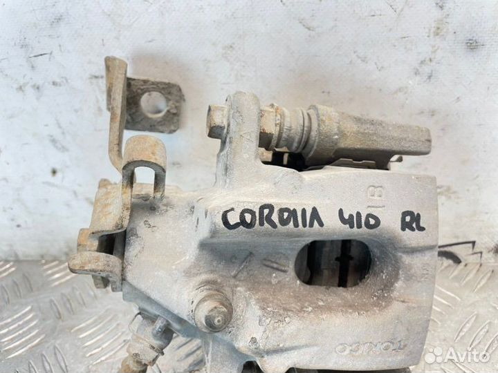 Суппорт тормозной задний левый Toyota Corolla