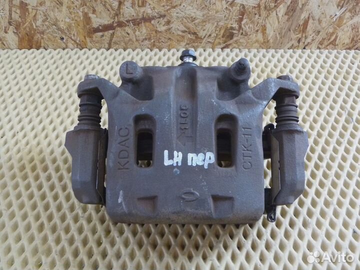 Суппорт передний левый Renault Koleos (HY) 2008-2016 (41011JY00A)