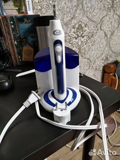 Электрическая зубная щетка