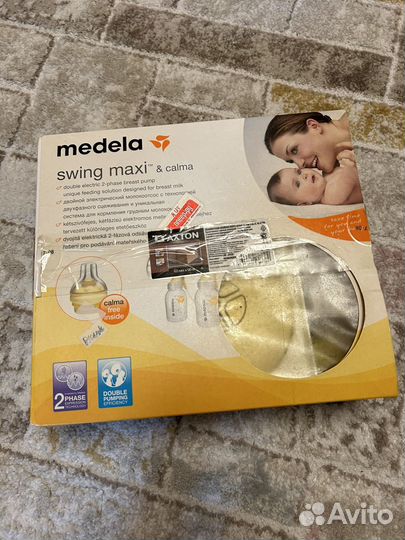 Молокоотсос Medela swing maxi