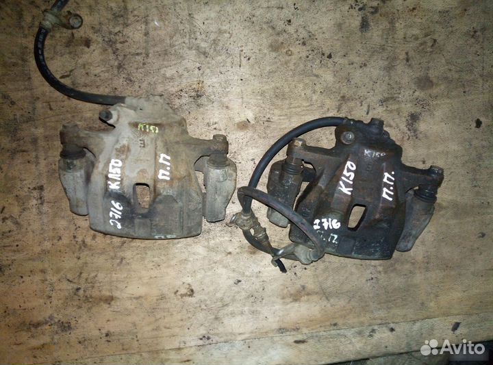 Суппорт передний правый Toyota Corolla E150