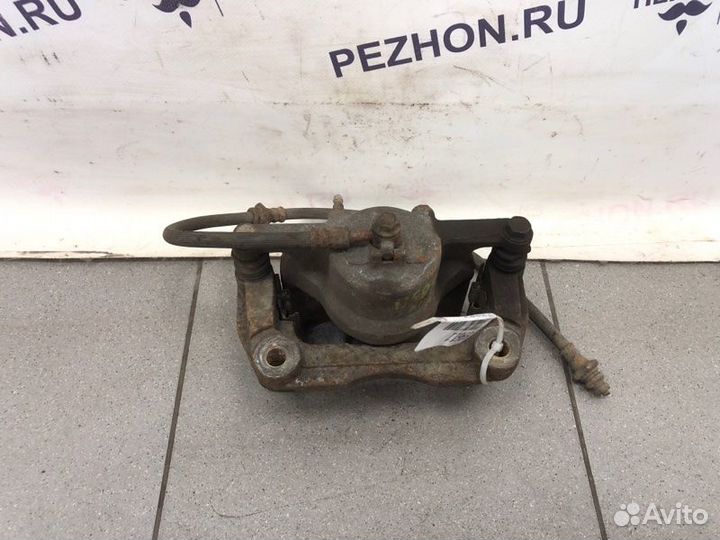 Суппорт тормозной передний левый Nissan Qashqai