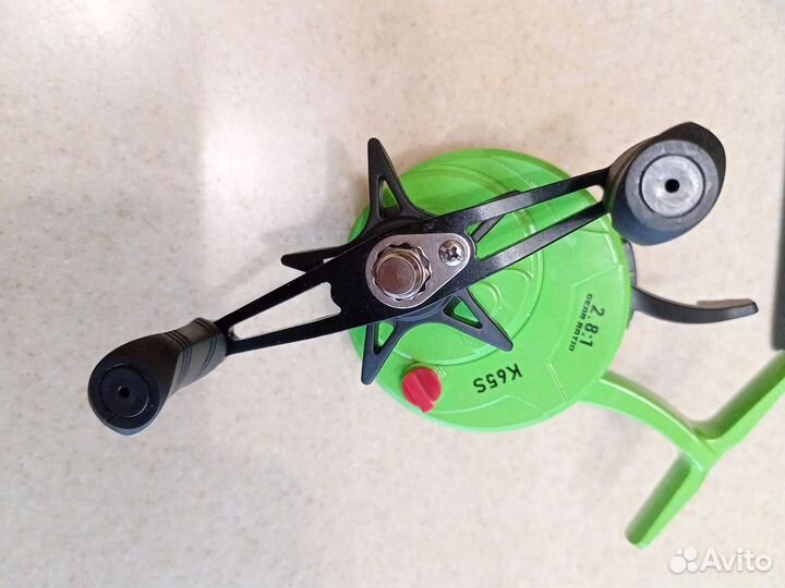 Катушка мультипликаторная зимняя с курком