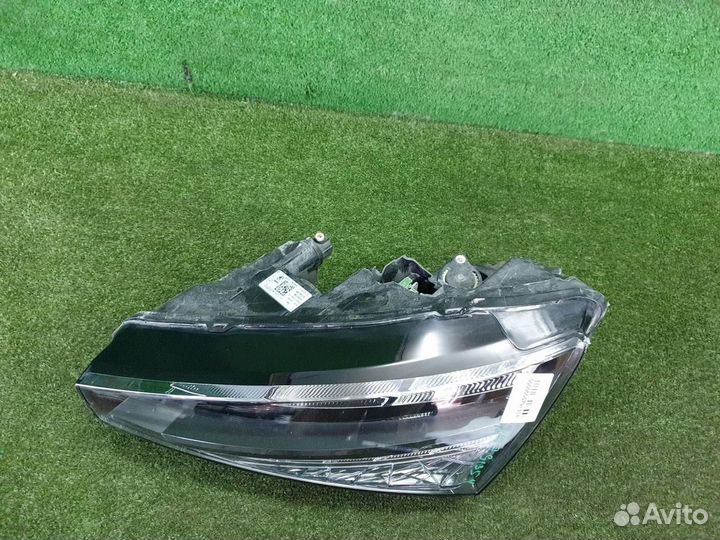 Фара левая Skoda Rapid