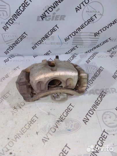 Суппорт тормозной передний левый Kia Sportage 3 SL