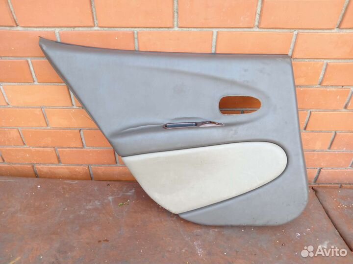 Дверная обшивка левая задняя на даево леганза 2.0л