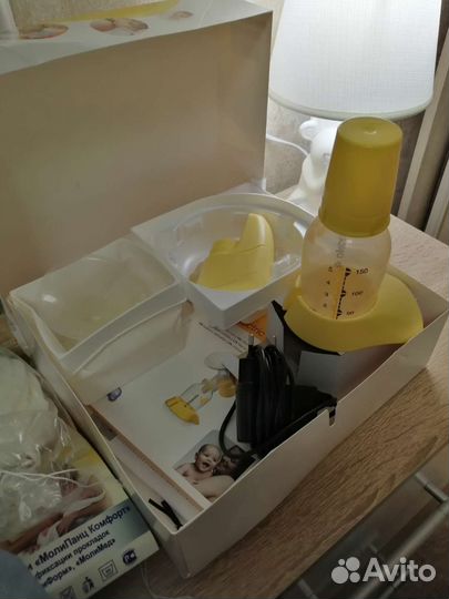 Молокоотсос medela электрический