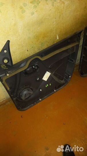 Обшивка двери renault logan