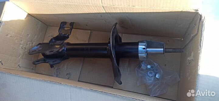 Стойка амортизатора передняя