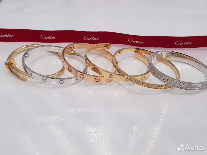 Золотые браслеты Cartier Love и Just un clou с бри