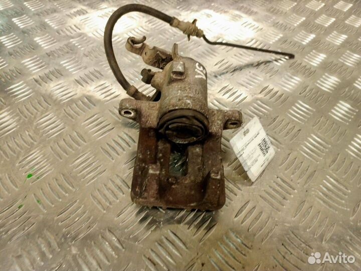 Суппорт тормозной задний левый Skoda Octavia