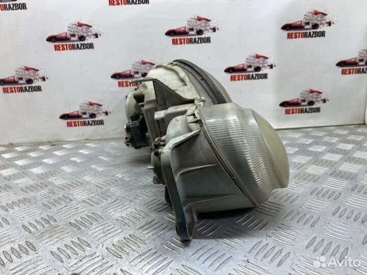 Фара галогеновая передняя левая Kia Shuma лифтбек