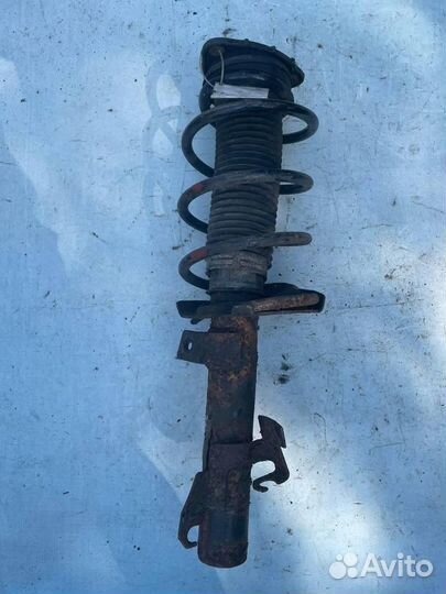 Стойка амортизатора передняя левая 31277018