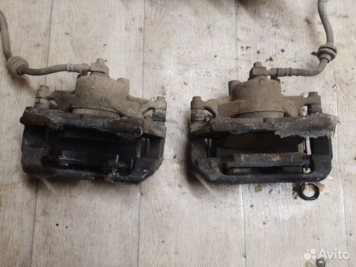 Суппорт тормозной передний Chevrolet Cruze 1.6