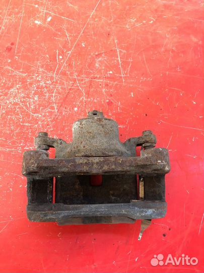 Суппорт тормозной передний правый Nissan Teana J32