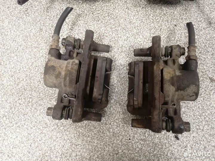 Суппорт тормозной задний Mitsubishi Outlander CU