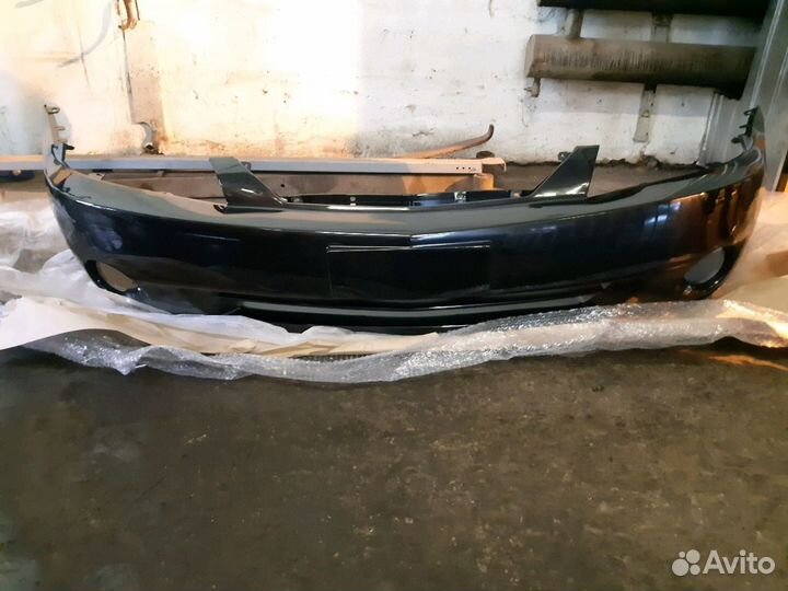 Бампер черный Kia Spectra