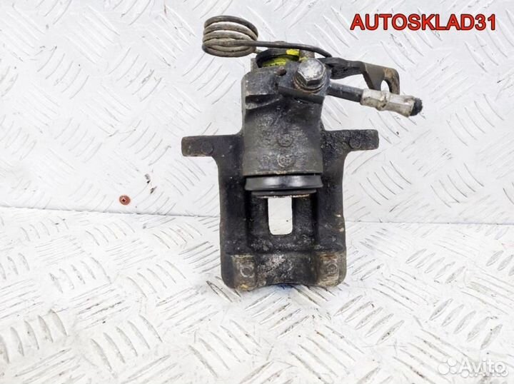 Суппорт тормозной задний левый VW Passat B5