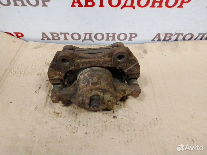 Суппорт тормозной передний левый Nissan Almera