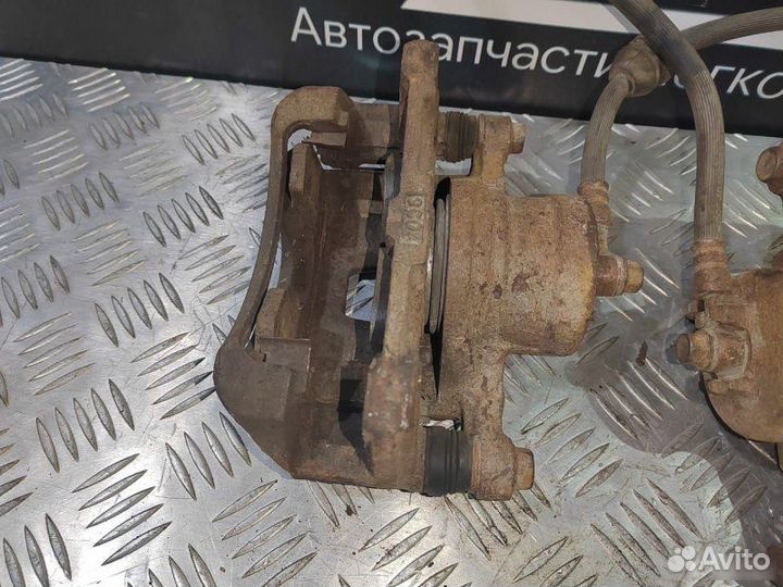 Суппорт левый Chevrolet Aveo T250 1.2