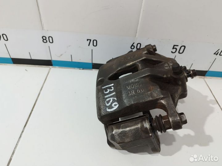 Суппорт тормозной передний левый ix35/Tucson 2010