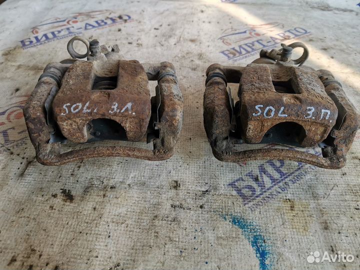 Суппорт тормозной задний левый Hyundai Solaris I